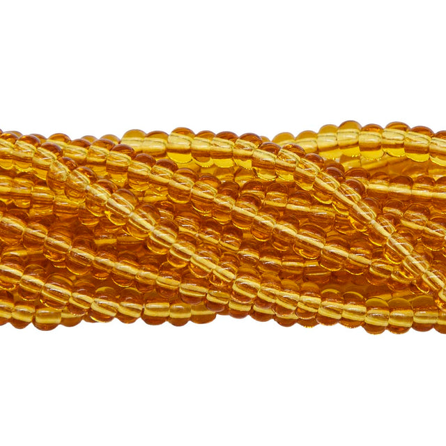 6SB254R: CZ Seed Bead Trans Topaz 6/0-6STR