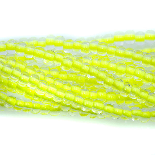 6SB723-N: CZ Seed Bead Neon Lined Yellow 6/0 Uv Reactive 36STR
