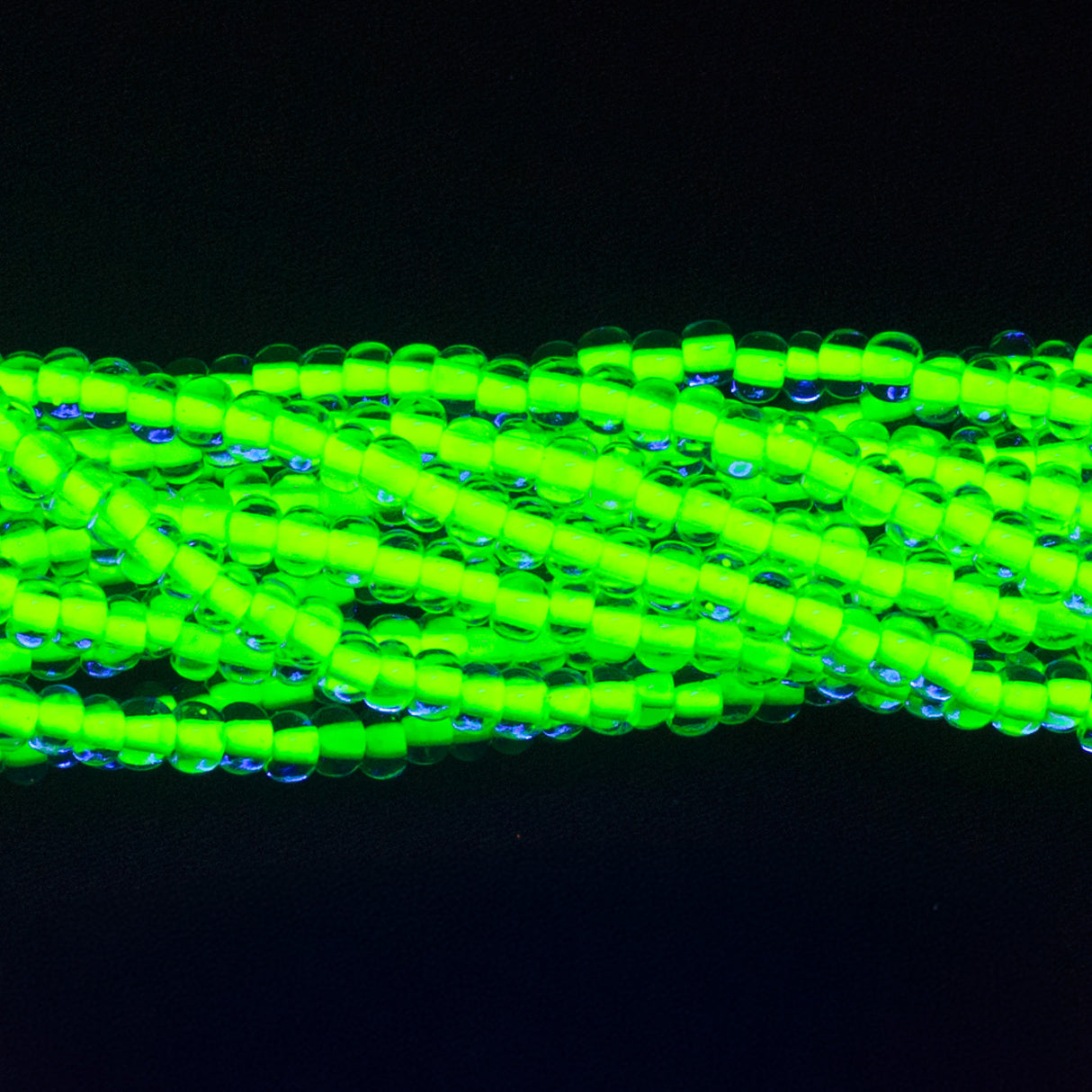 6SB723-N: CZ Seed Bead Neon Lined Yellow 6/0 Uv Reactive 36STR