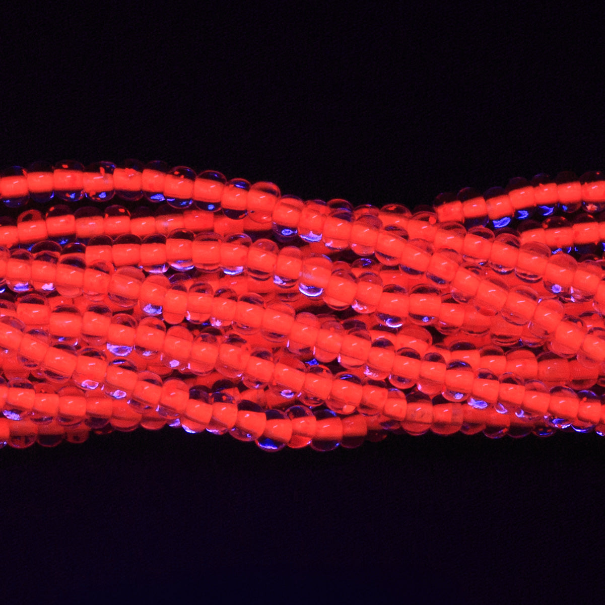 6SB734-N: CZ Seed Bead Neon Lined Orange 6/0 Uv Reactive 36STR