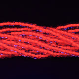 6SB734-N: CZ Seed Bead Neon Lined Orange 6/0 Uv Reactive 36STR
