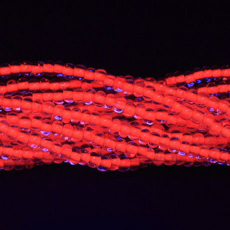 6SB734-NR: CZ Seed Bead Neon Lined Orange 6/0 Uv Reactive-6STR