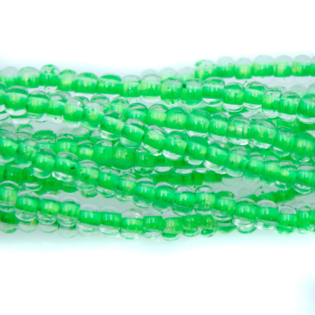6SB784-NR: CZ Seed Bead Neon Lined Green 6/0 Uv Reactive-6STR