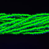 6SB784-NR: CZ Seed Bead Neon Lined Green 6/0 Uv Reactive-6STR
