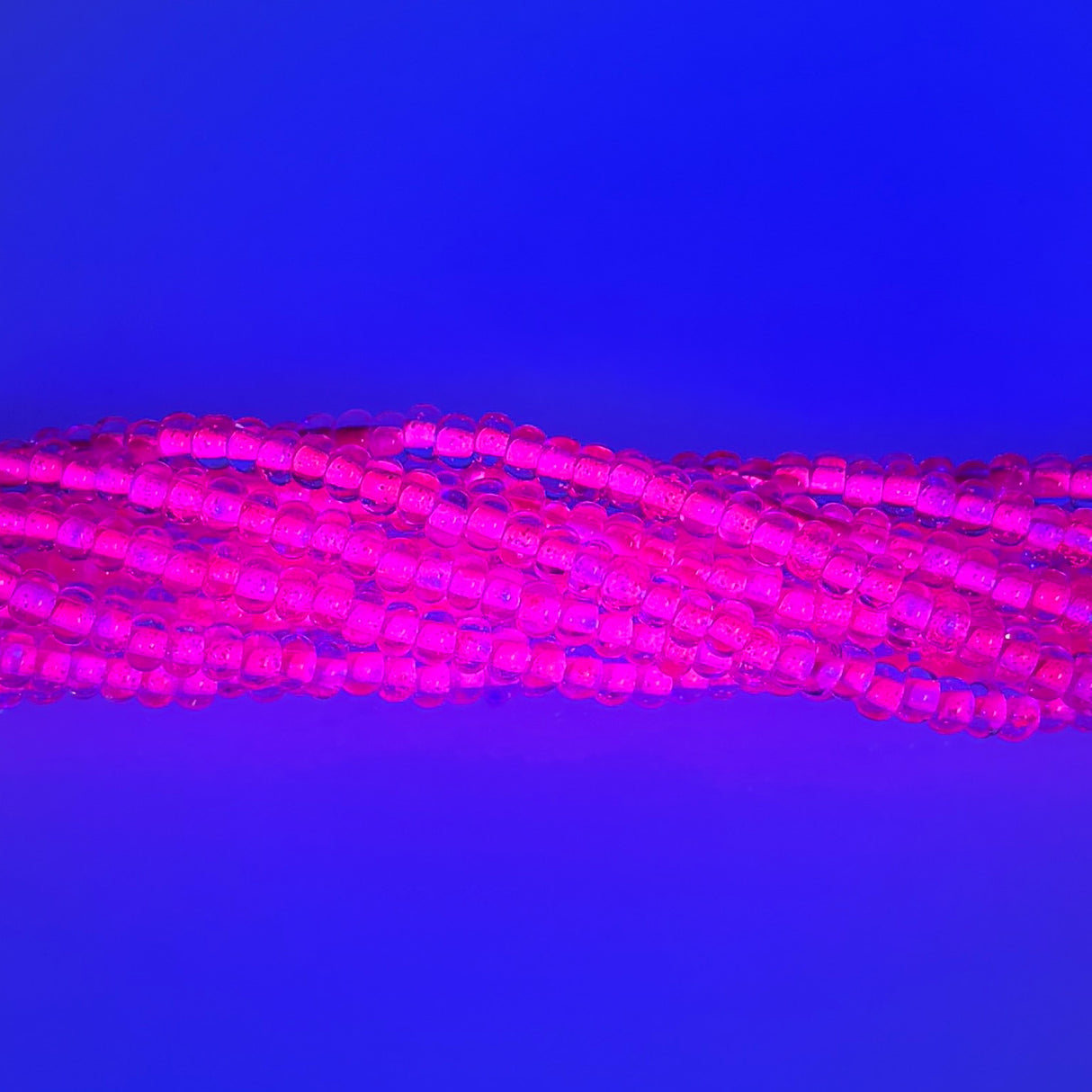 6SB793-NR: CZ Seed Bead Neon Lined Pink 6/0 Uv Reactive-6STR
