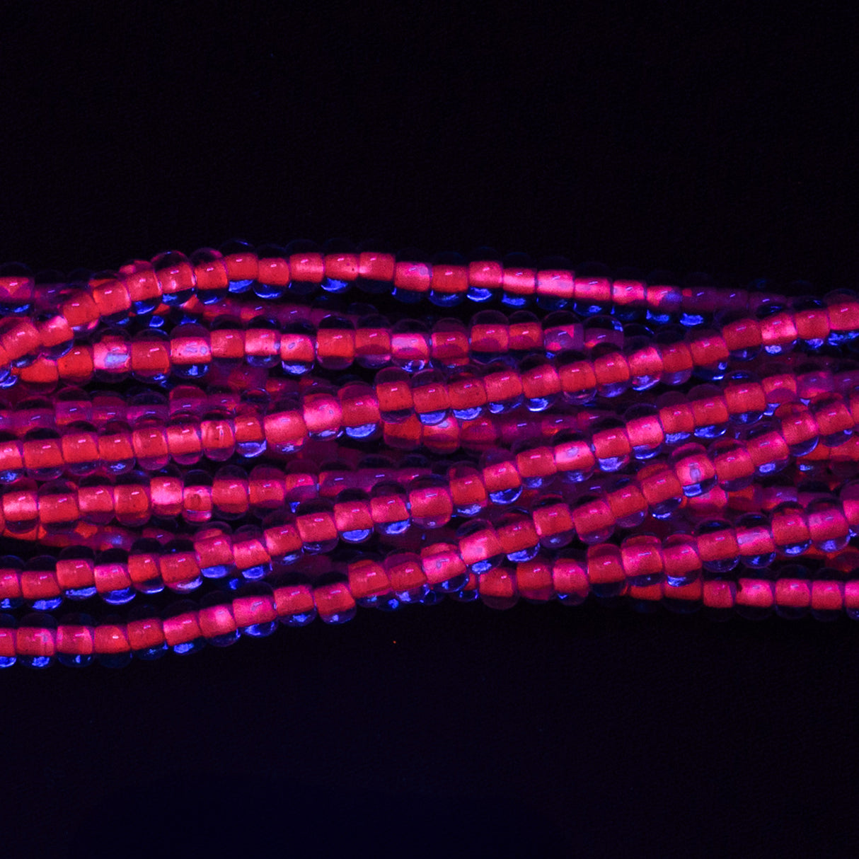 6SB798-N: CZ Seed Bead Neon Lined Purple 6/0 Uv Reactive 36STR