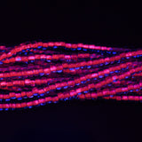 6SB798-N: CZ Seed Bead Neon Lined Purple 6/0 Uv Reactive 36STR