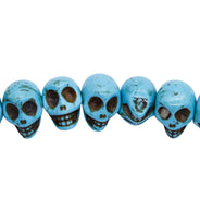 6ST50-B: 14x10mm Blue Magnesite Skull Beads 15.5"