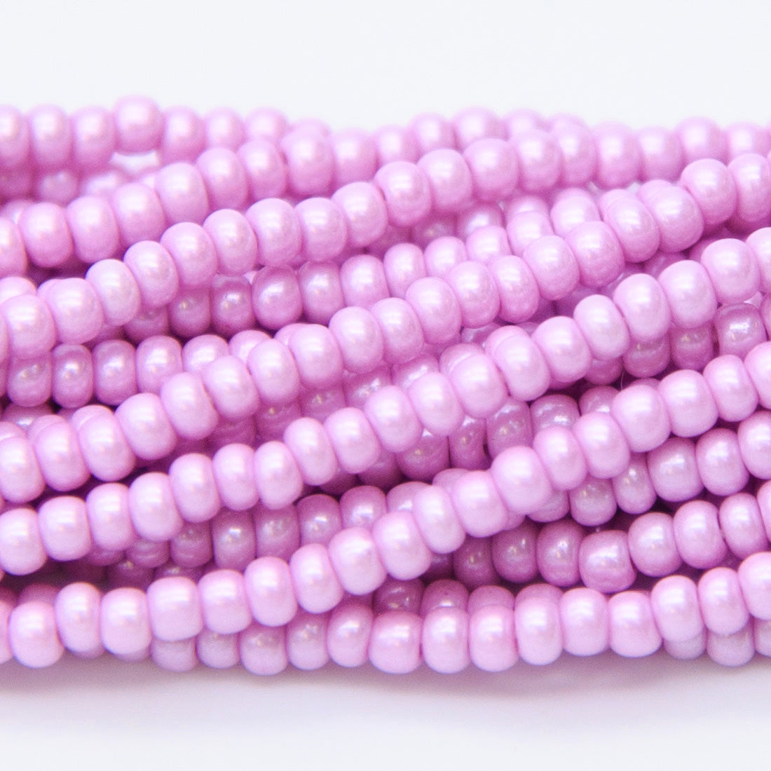 8SB696-A: CZ Seed Bead Silk DK Pink/Violet 8/0 3HK