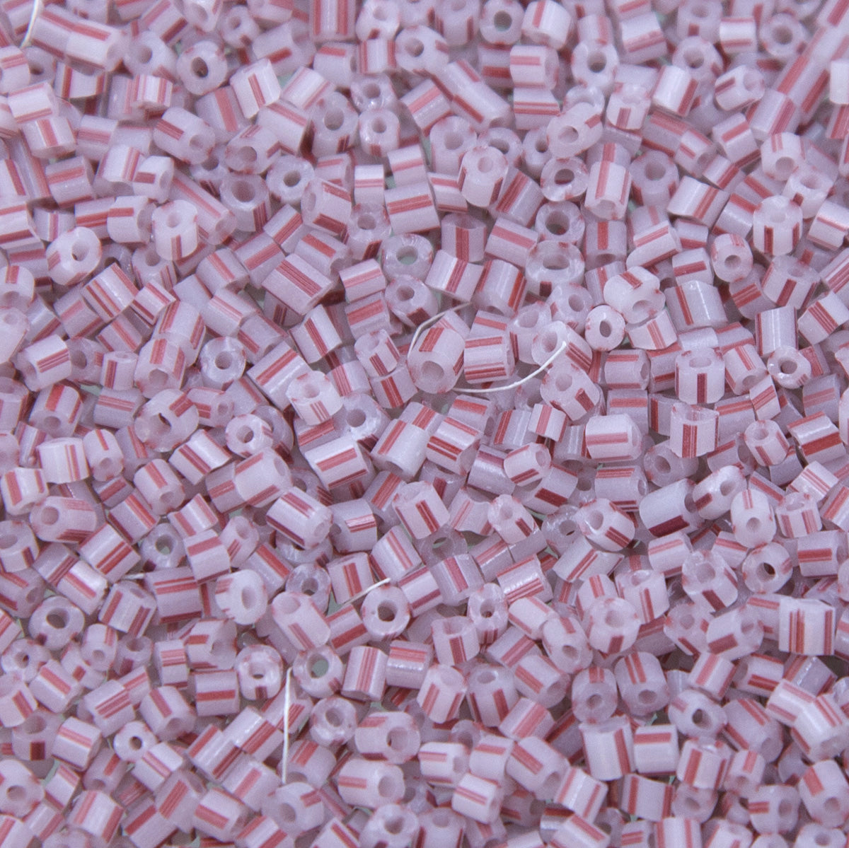 9SV100-33: Vintage Venetian Seed Bead Tr White With Red Stripe 9/0