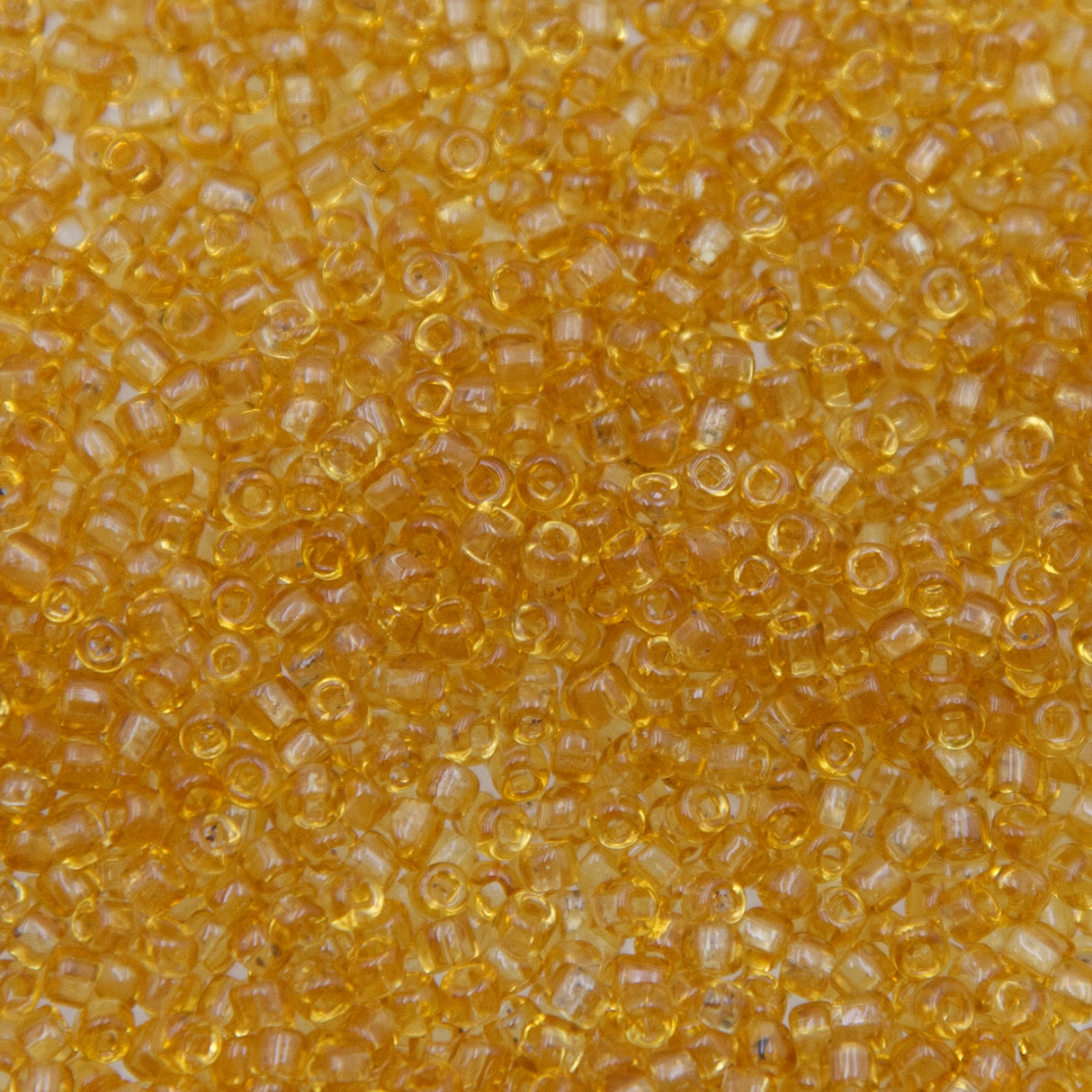 9SV100-43: Vintage Venetian Seed Bead Tr Honey Yellow 9/0