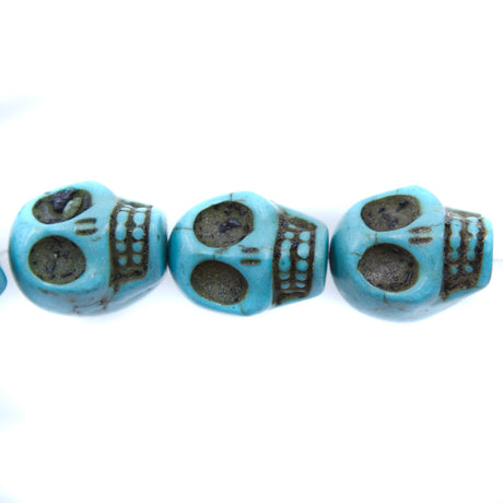 ST50-B: 18x13mm Blue Magnesite Skull Beads 15.5"
