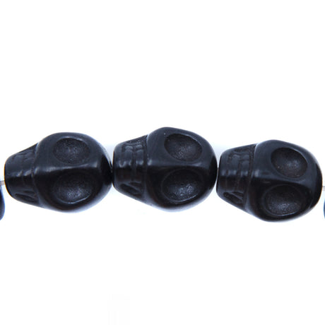 ST50-BK: 18x13mm Black Magnesite Skull Beads 15.5"